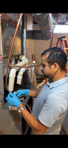 Puspa working on HVAC system